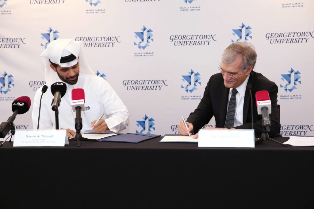 Dr. Robert M. Groves and Mr. Hassan Al Thawadi Signing the Agreement