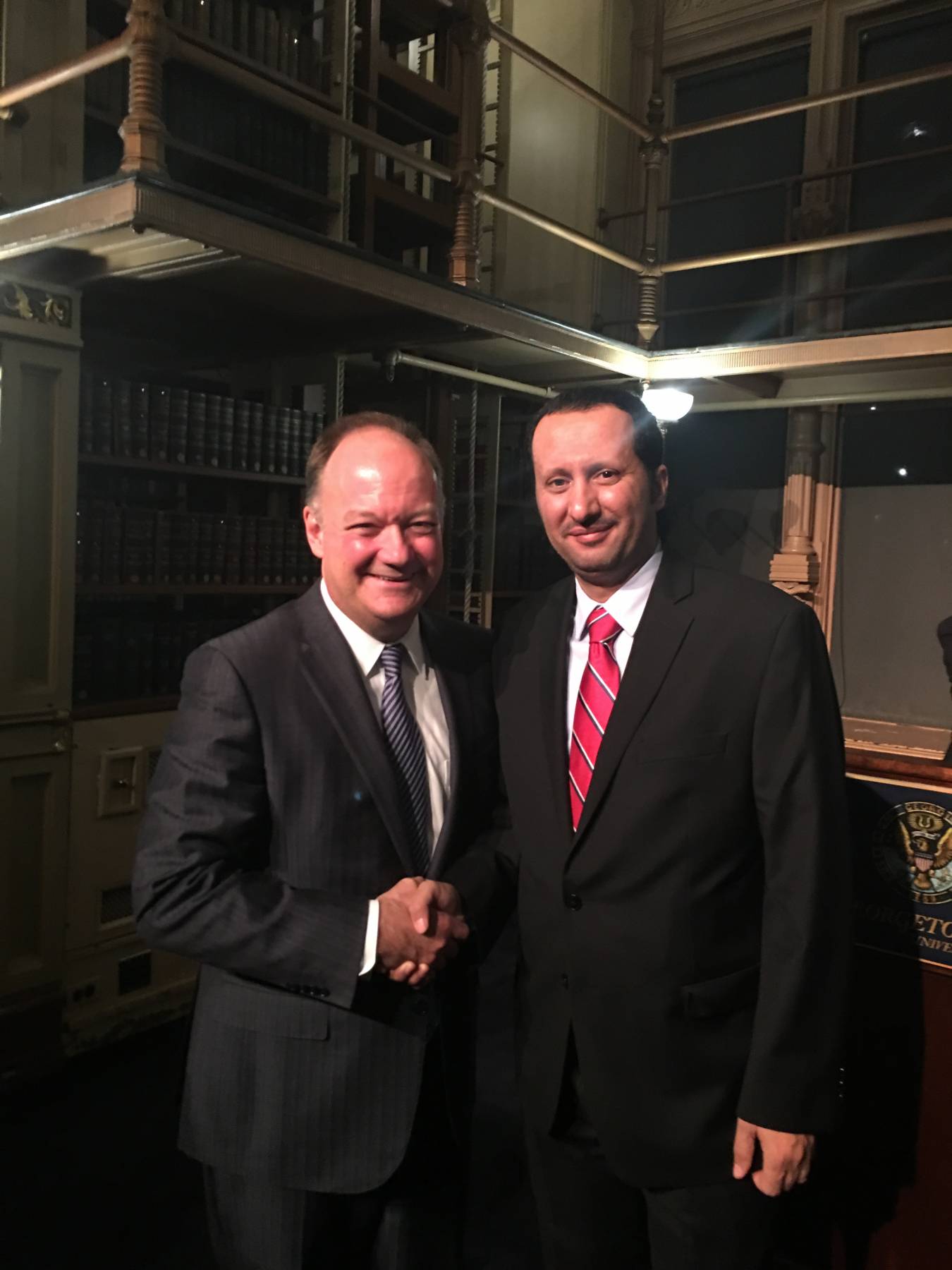 Omar Al Swadi with Georgetown University President John J. DeGioia