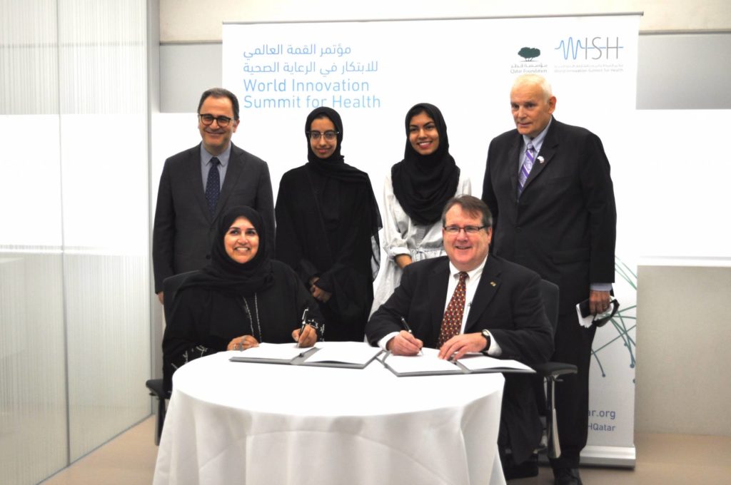 GU-Q Dean Dr. Ahmad S Dallal and GU-Q Senior Asma Al Jehani along with NU-Q Dean Everette E Dennis and NU-Q student Ayilah Chaudhary