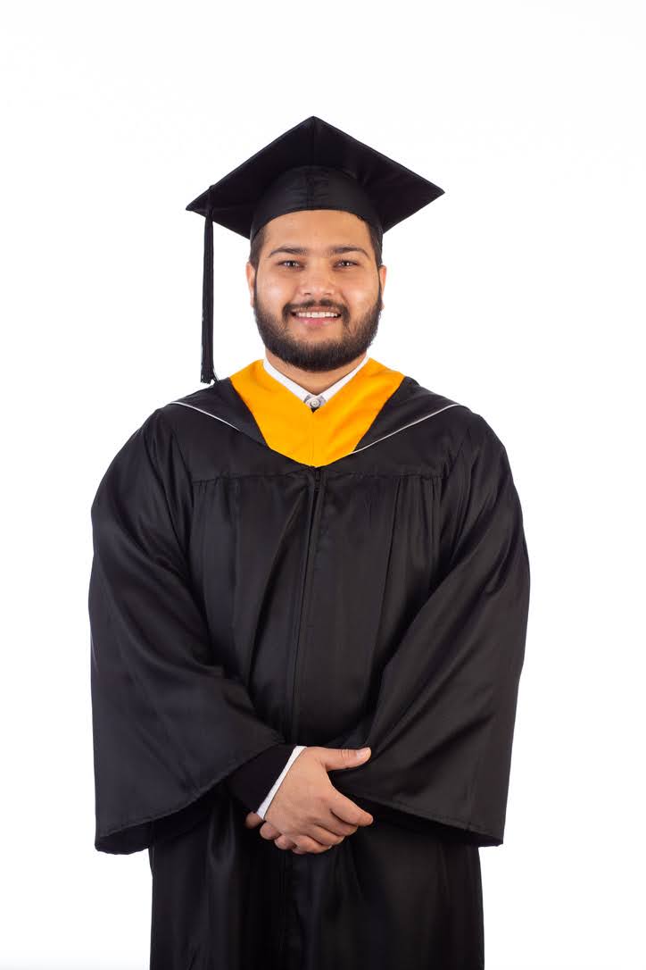 An image of Aashish Karn wearing graduation regalia.