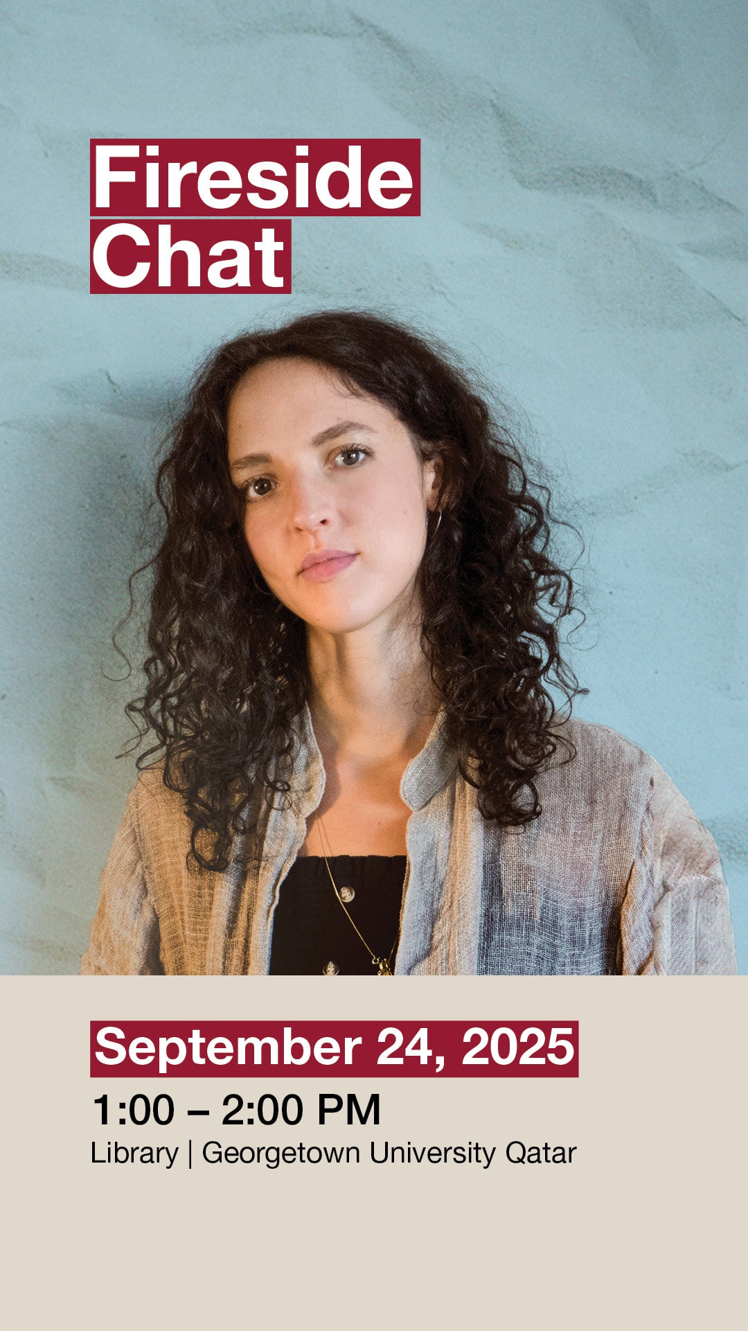 A woman with curly hair stands against a light blue textured wall. Text reads: Fireside Chat. September 24, 2025, 1:00 – 2:00 PM, Library | Georgetown University Qatar.