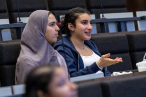 two girls sitting in a classroom