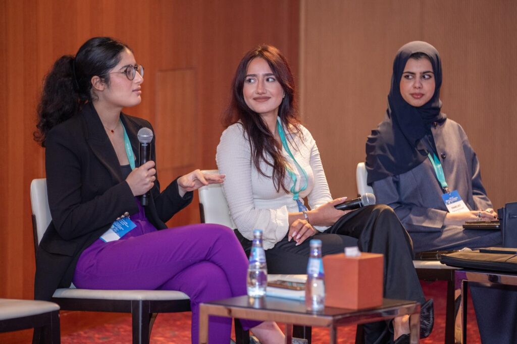 students Fatma Al-Emadi, Rafal Sarout, and Maya Saqr